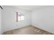 A bright bedroom featuring neutral carpet and a window providing natural light at 171 Seabreeze Cir, Kissimmee, FL 34743