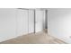 Bedroom features neutral carpet, white walls, and sliding closet doors at 171 Seabreeze Cir, Kissimmee, FL 34743