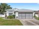 Charming single-Gathering home featuring an attached garage and well-maintained landscaping at 171 Seabreeze Cir, Kissimmee, FL 34743