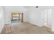 Spacious living room showcasing neutral carpeting and sliding glass doors to enclosed patio at 171 Seabreeze Cir, Kissimmee, FL 34743