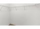 Walk-in closet featuring metal racks for storage of clothing and other accessories at 171 Seabreeze Cir, Kissimmee, FL 34743