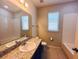 Well-lit bathroom with a bathtub, shower, and extended countertop space at 1726 Brassie Ct, Kissimmee, FL 34746