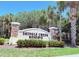 Beautiful stone entrance sign for Shingle Creek Reserve with landscaping at 1726 Brassie Ct, Kissimmee, FL 34746