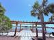 Dock on lake with pergola and benches, a perfect spot for relaxation at 1726 Brassie Ct, Kissimmee, FL 34746