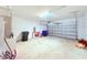 Spacious garage with an overhead door and plenty of storage space at 1726 Brassie Ct, Kissimmee, FL 34746