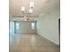 Bright, open living room featuring tile flooring, high ceilings, and natural light from multiple windows at 1726 Brassie Ct, Kissimmee, FL 34746