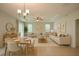 Stylishly furnished living and dining area with modern decor, neutral colors, and a cozy ambiance at 1726 Brassie Ct, Kissimmee, FL 34746