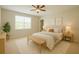 Bright and airy main bedroom showcasing neutral decor, carpet, and a comfy bed with stylish accents at 1726 Brassie Ct, Kissimmee, FL 34746