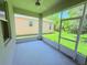 Screened-in patio with ceiling fan, with views of the yard at 1726 Brassie Ct, Kissimmee, FL 34746