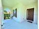 Welcoming front porch with a view and a stylish brown front door at 1726 Brassie Ct, Kissimmee, FL 34746
