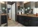 Bathroom featuring double sinks, granite counters and modern fixtures at 1825 Needham Rd, Apopka, FL 32712
