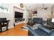 Open-concept living room with vaulted ceilings and hardwood flooring at 1825 Needham Rd, Apopka, FL 32712