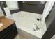 Corner soaking tub, granite counters and dark cabinets in this well-appointed main bath at 1825 Needham Rd, Apopka, FL 32712