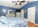 Vaulted primary bedroom features a matching furniture set and relaxing decor at 1825 Needham Rd, Apopka, FL 32712