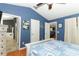 Bright main bedroom features vaulted ceiling, ceiling fan, and ensuite bathroom entrance at 1825 Needham Rd, Apopka, FL 32712