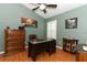 Office space with desk, brown leather chair, cabinet and dark wood dresser at 1825 Needham Rd, Apopka, FL 32712