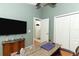 A bonus room is set up as an office with a view of the front door at 1825 Needham Rd, Apopka, FL 32712