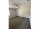 This bedroom features neutral walls, carpeted floors, and a ceiling fan at 1880 N Crystal Lake Dr # 3, Lakeland, FL 33801