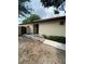 Beige single story home featuring a walkway leading to front door and landscaped details at 1880 N Crystal Lake Dr # 3, Lakeland, FL 33801
