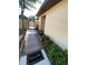 Pathway to the home showcases well-maintained greenery and a welcoming entrance mat at 1880 N Crystal Lake Dr # 3, Lakeland, FL 33801
