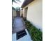 Charming walkway leading to the home, adorned with vibrant green landscaping and a welcoming entrance mat at 1880 N Crystal Lake Dr # 3, Lakeland, FL 33801