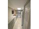 Galley kitchen with gray cabinets, white appliances, and tile floors at 1880 N Crystal Lake Dr # 3, Lakeland, FL 33801