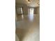 A naturally lit room with tile flooring, ceiling fan, and access to the front door at 1880 N Crystal Lake Dr # 3, Lakeland, FL 33801