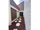 A walkway lined with mulch and stepping stones to the side of the home at 1880 N Crystal Lake Dr # 3, Lakeland, FL 33801