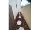 A walkway lined with mulch and stepping stones, secured by a gate at 1880 N Crystal Lake Dr # 3, Lakeland, FL 33801