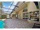 A view of the back patio with brick pavers and access to the pool at 1969 Crystal Downs Ct, Oviedo, FL 32765