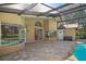A view of the back patio with brick pavers and access to the pool at 1969 Crystal Downs Ct, Oviedo, FL 32765
