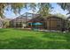 View of a beautiful screened in lanai, backyard, and pool area that is perfect for relaxation and entertainment at 1969 Crystal Downs Ct, Oviedo, FL 32765