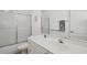 Well-lit bathroom featuring a shower with sliding glass doors and a vanity with a large mirror at 1969 Crystal Downs Ct, Oviedo, FL 32765