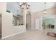 Spacious living room showcasing decorative tile flooring and arched entryways to other rooms at 1969 Crystal Downs Ct, Oviedo, FL 32765