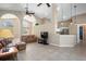 Open-concept living area with tile flooring, high ceilings, and a seamless flow to the kitchen at 1969 Crystal Downs Ct, Oviedo, FL 32765