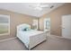 Bright main bedroom with a ceiling fan, natural light, and access to an ensuite bathroom at 1969 Crystal Downs Ct, Oviedo, FL 32765