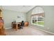 Well-lit home office with a vaulted ceiling, large window, and functional desk setup at 1969 Crystal Downs Ct, Oviedo, FL 32765