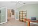 View of the study from the living room, featuring a built-in bookshelf and modern decor at 1969 Crystal Downs Ct, Oviedo, FL 32765