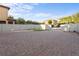 A spacious backyard with a brick-paved area, a white fence, and lush greenery at 1978 Fishtail Fern Way, Ocoee, FL 34761