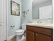 Clean, standard bathroom with a sink, toilet, and vanity, featuring soft blue walls and neutral accents at 1978 Fishtail Fern Way, Ocoee, FL 34761