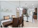 Inviting dining area with stylish furniture, blending seamlessly with kitchen features at 1978 Fishtail Fern Way, Ocoee, FL 34761