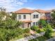 Attractive exterior elevation featuring a terracotta roof and blue shutters surrounded by trees at 1978 Fishtail Fern Way, Ocoee, FL 34761