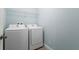 Functional laundry room is equipped with modern appliances at 1978 Fishtail Fern Way, Ocoee, FL 34761