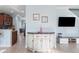 Stylish living room with tile floors and views into kitchen and dining room at 1978 Fishtail Fern Way, Ocoee, FL 34761