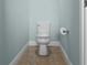 Clean and simple powder room with a standard toilet and neutral wall color at 1978 Fishtail Fern Way, Ocoee, FL 34761
