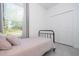 Cozy bedroom featuring natural light from the window and built-in closet space at 2024 Sw 153Rd Loop, Ocala, FL 34473