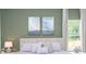 Olive green accent wall highlights the king bed and side tables with lamps and art pieces at 2024 Sw 153Rd Loop, Ocala, FL 34473