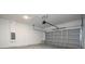 Spacious two-car garage with concrete floor and automatic door opener at 2024 Sw 153Rd Loop, Ocala, FL 34473