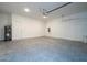 Large garage space featuring concrete floor, water heater, and ample room for vehicles at 2024 Sw 153Rd Loop, Ocala, FL 34473