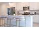 Well-equipped kitchen showcasing stainless steel appliances, granite countertops, and sleek, white cabinetry at 2024 Sw 153Rd Loop, Ocala, FL 34473